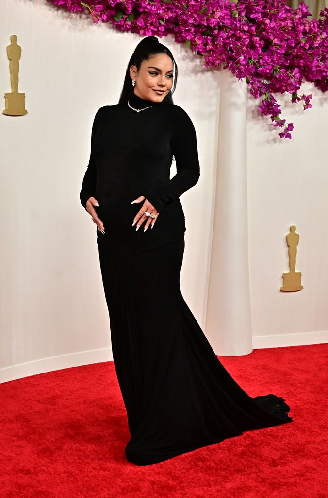 Vanessa Hudgens black dress showcasing baby bump at Academy Awards