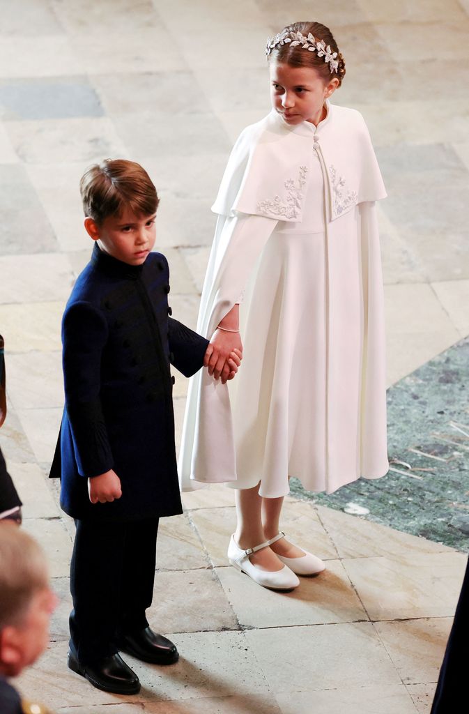 Prince George and Princess Charlotte arrive for the Coronation of King Charles III and Queen Camilla on May 6, 2023 in London, England.