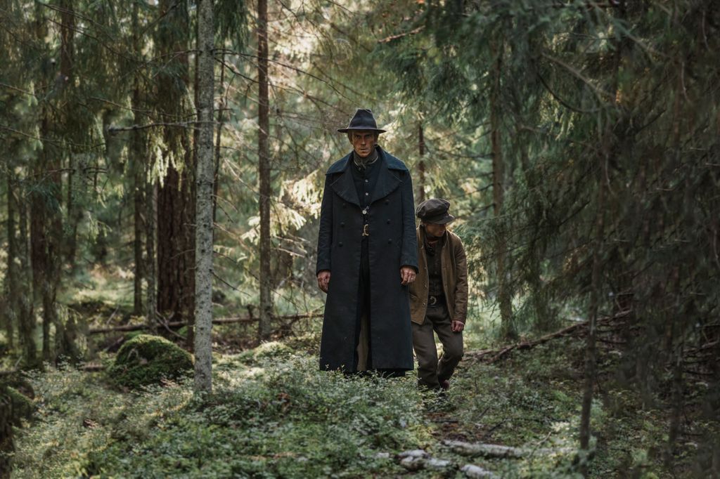 Two people walk in the woods