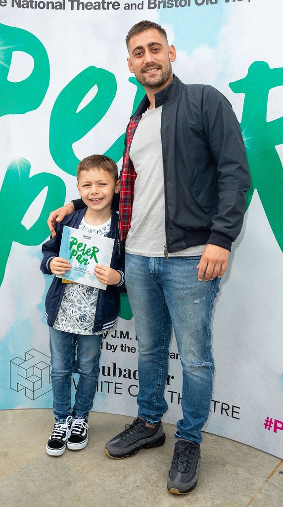 Michael Socha stands with his son