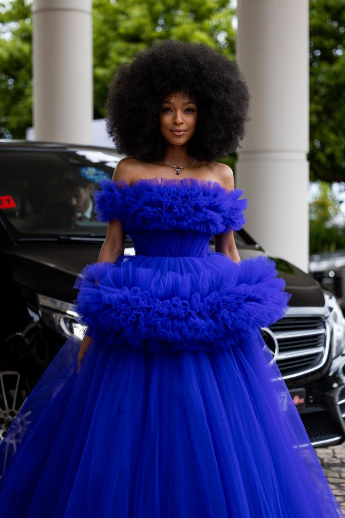 Didi Stone looked exquisite in a royal blue off-the- shoulder dress with dramatic tulle detailing