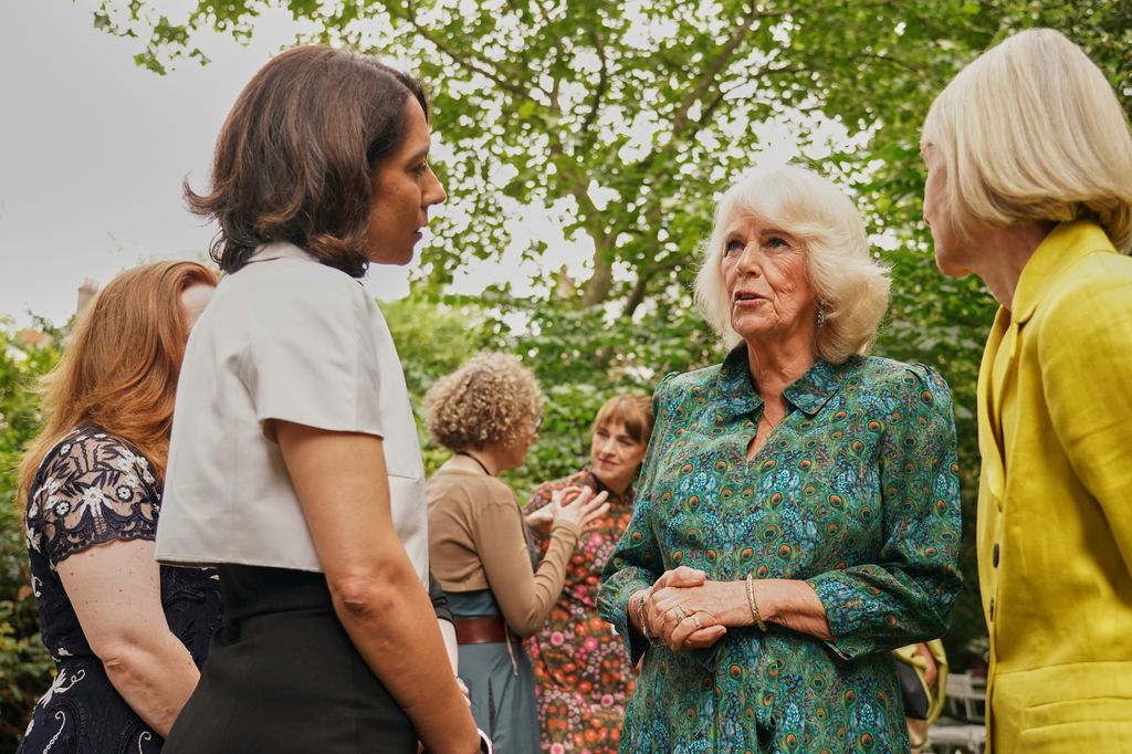 Queen Camilla talking to a group of women
