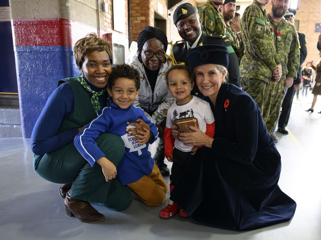 Sophie with children and soldiers