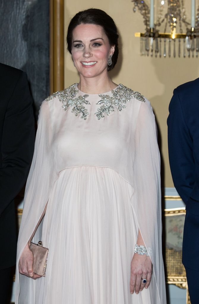 Princess Kate wearing  a pale pink dress with silver embelleshments