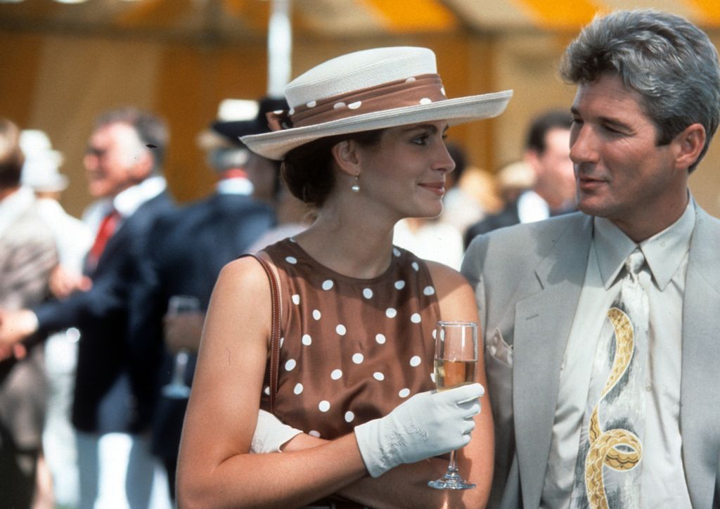 Julia Roberts has a drink with Richard Gere in a scene from the film 'Pretty Woman', 1990