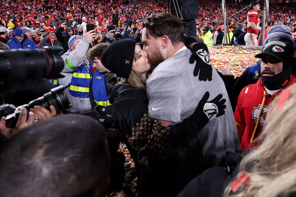 Taylor Swift kisses Travis Kelce #87 of the Kansas City Chiefs 