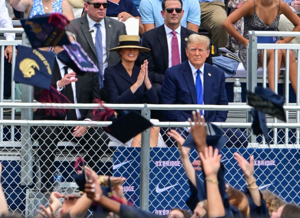Former US President Donald Trump, with former First Lady Melania Trump (L), attends the graduation ceremony of his son, Barron Trump