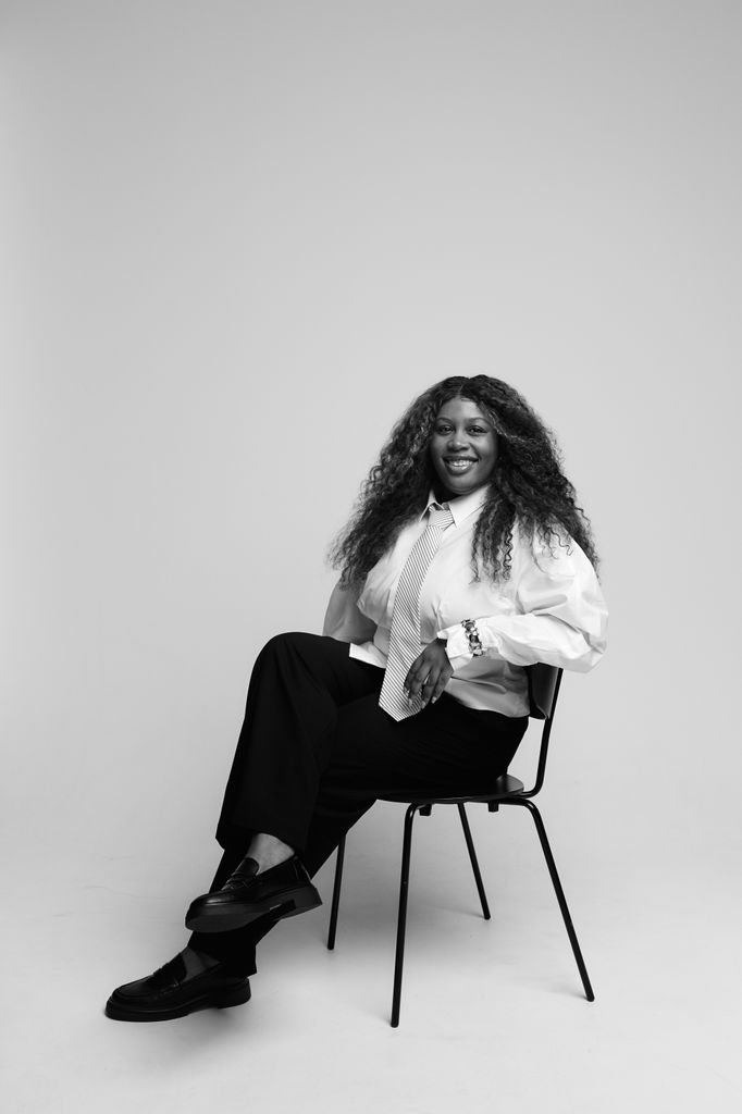 The power tie is back - and Aaliyah understood the assignment. Menswear-inspired tailoring meets megawatt smile in this striking monochrome portrait. - Aaliyah Harry, Beauty Writer