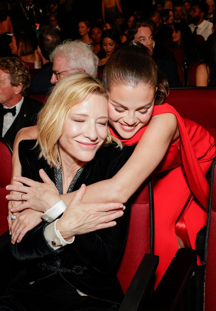 two women hugging in theatre