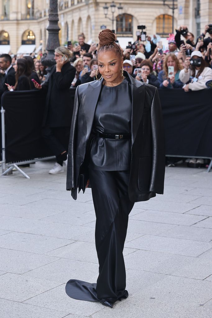 Janet Jackson in leather blazer and black silk skirt at Tom Ford show