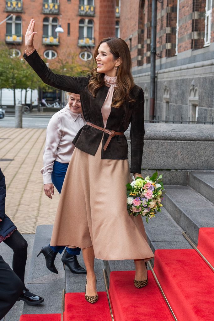 Queen Mary arrived at Copenhagen City Hall as she attended the Children's Aid Day in leopard print kicks