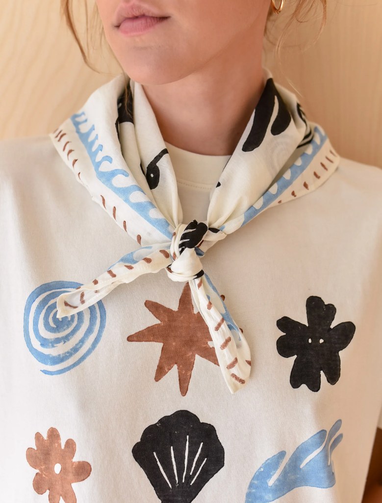 A cotton scarf tied around a models neck