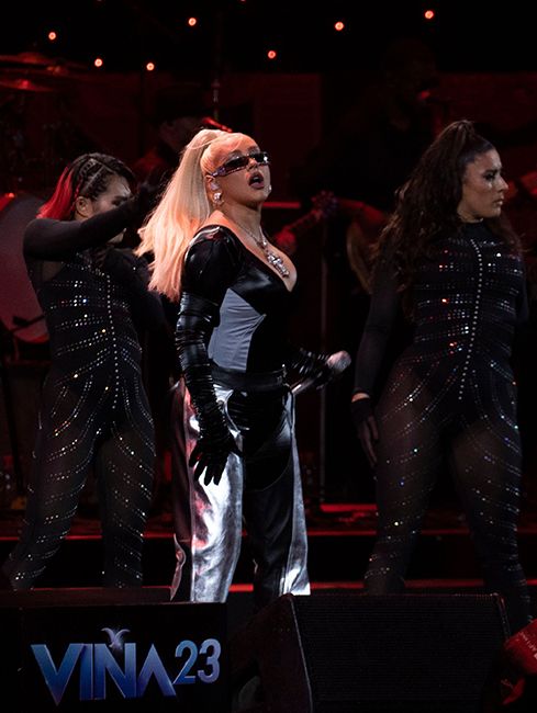 christina aguilera in daring silver trousers and bodysuit onstage at Vina del Mar International Song Festival