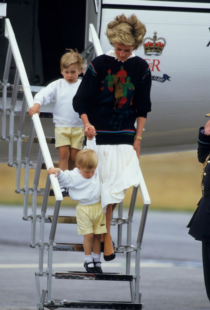 Diana, Princess of Wales, with her young sons Prince William and Prince Harry arrive at Aberdeen Airport