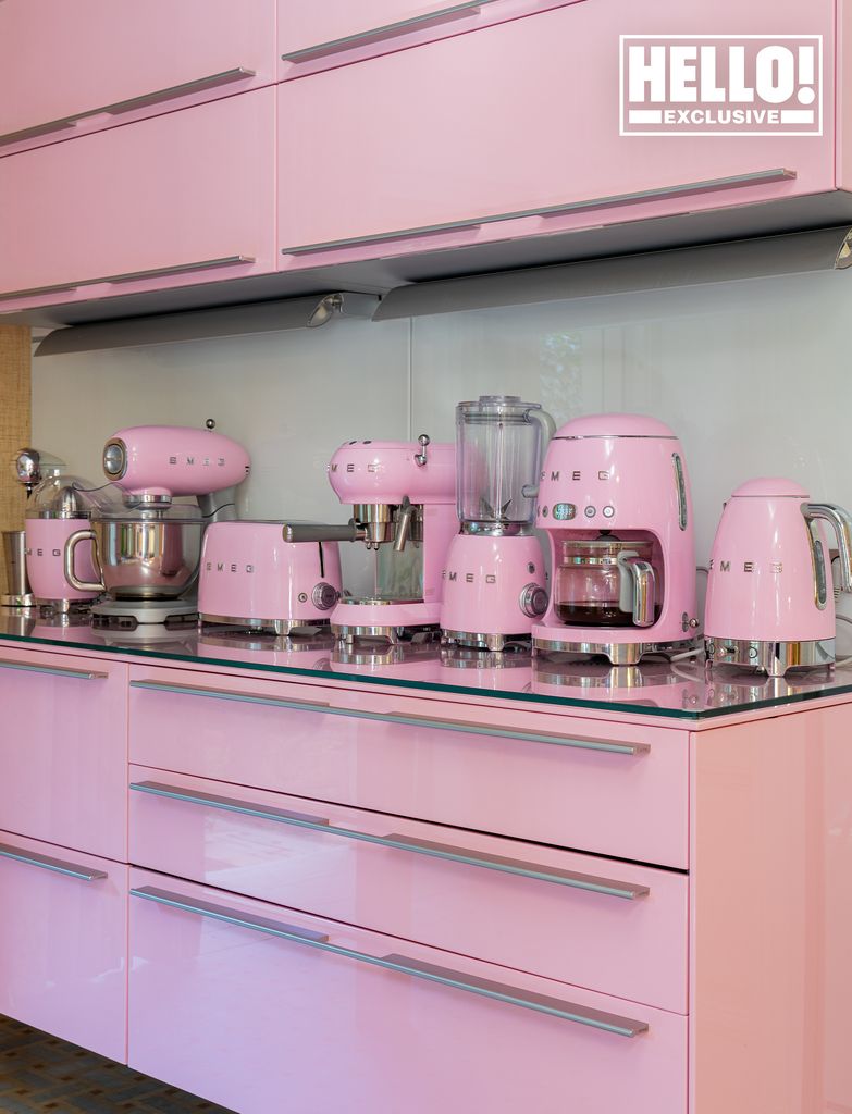 Celia Kritharioti home kitchen with pink cabinets and Smeg appliances on display