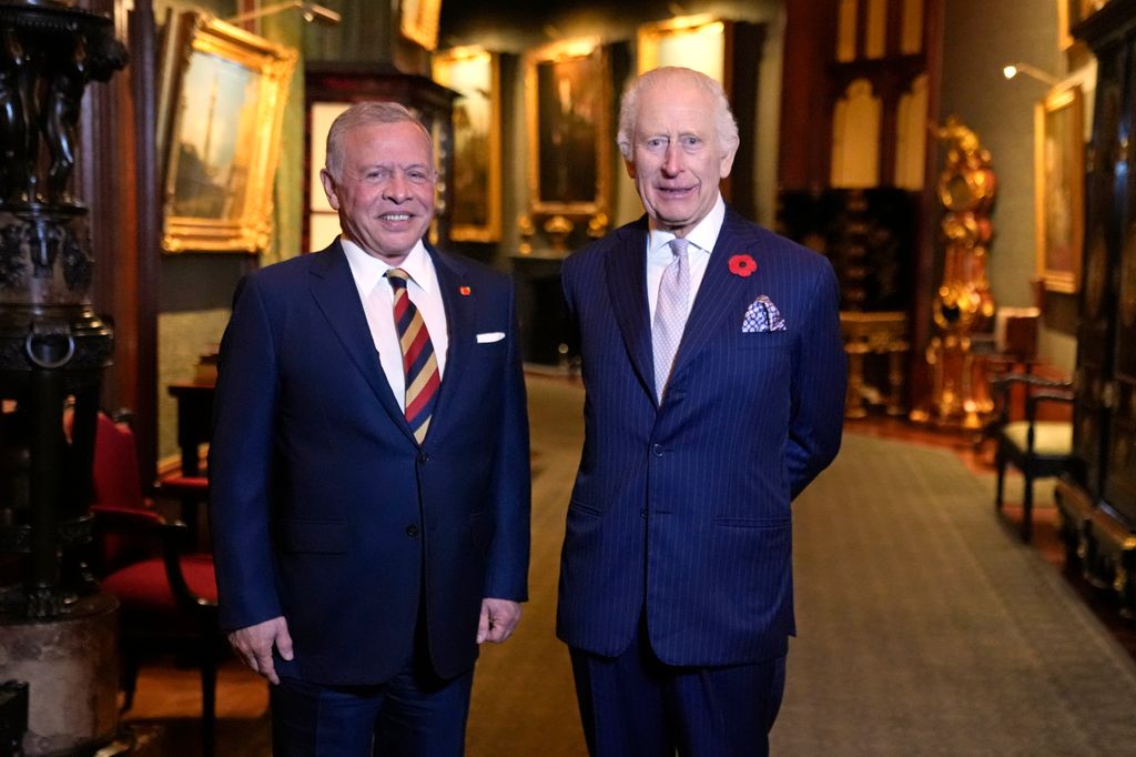 King Abdullah and King Charles standing in blue suits