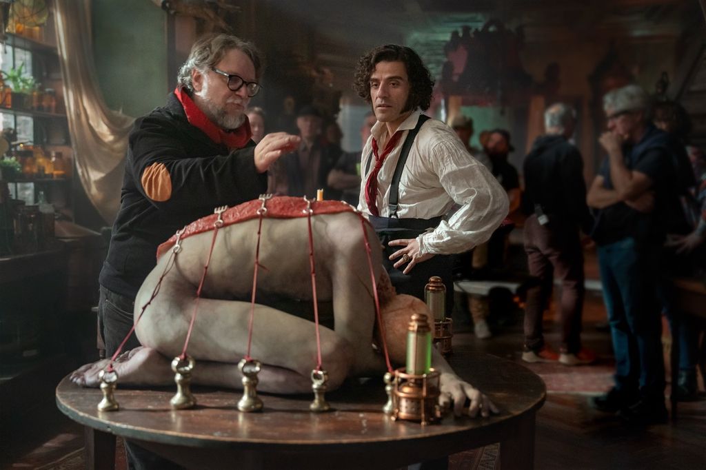 Director Guillermo del Toro and Oscar Issac as Victor Frankenstein on set