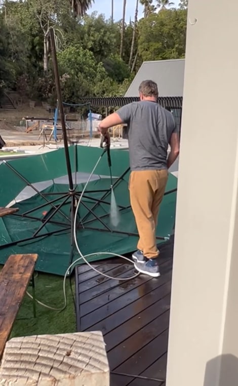 Dax Shepard tending to their family garden