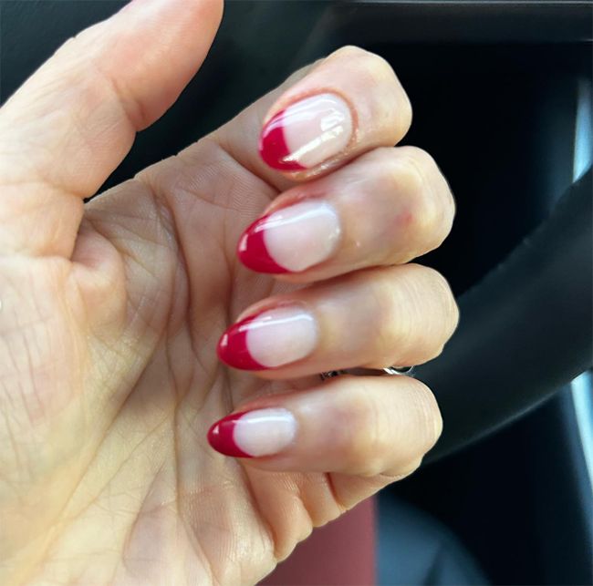 Hand with red French tips