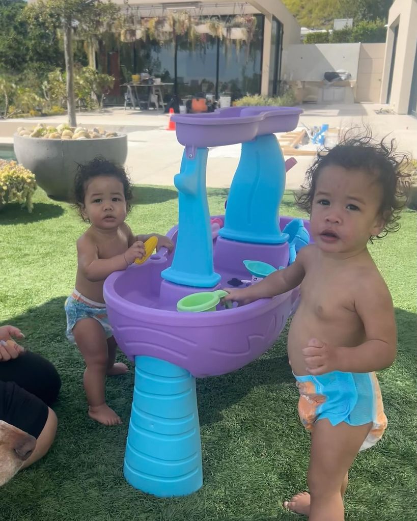 Chrissy Teigen's kids with a water table