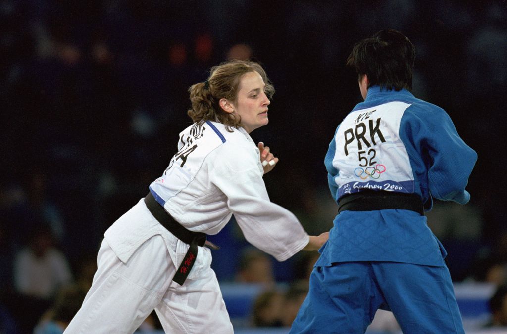 Hillary Wolf of the United States against San Hui Kye of Korea in the Womens 52 kg Judo match during the Sydney Olympic Games 