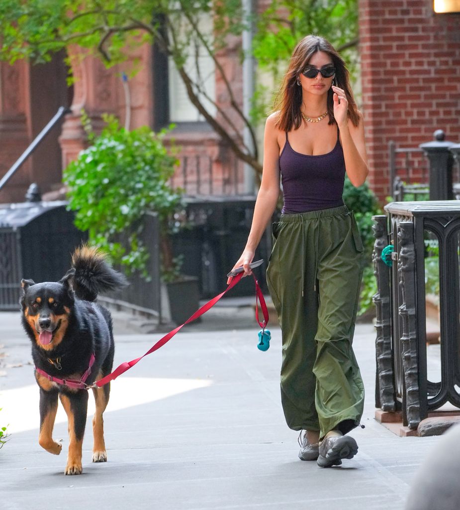 The model has transformed dog walk dressing into an opportunity to showcase her street style prowess