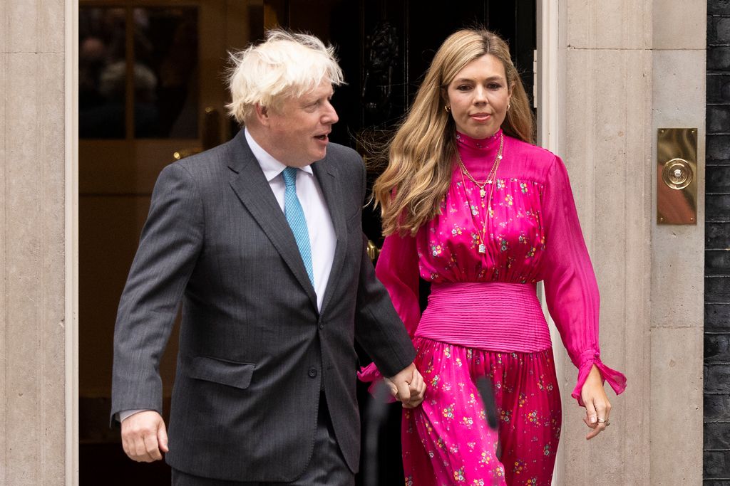 Former Prime Minister Boris Johnson and wife Carrie Johnson at Downing Street.Carrie is wearing a pink dress 