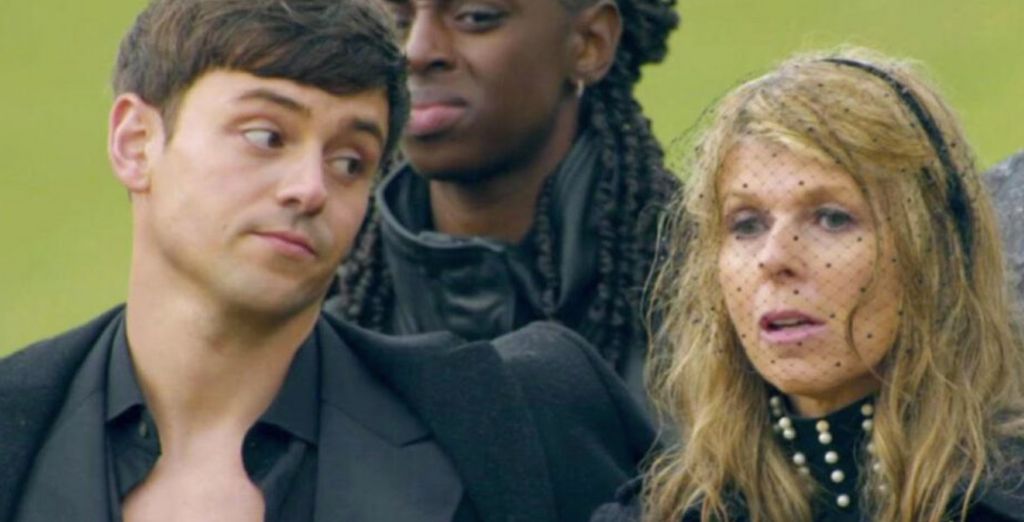 Tom Daley giving Kate Garraway side-eye on the Celebrity Traitors; Cat Burns stands in the background
