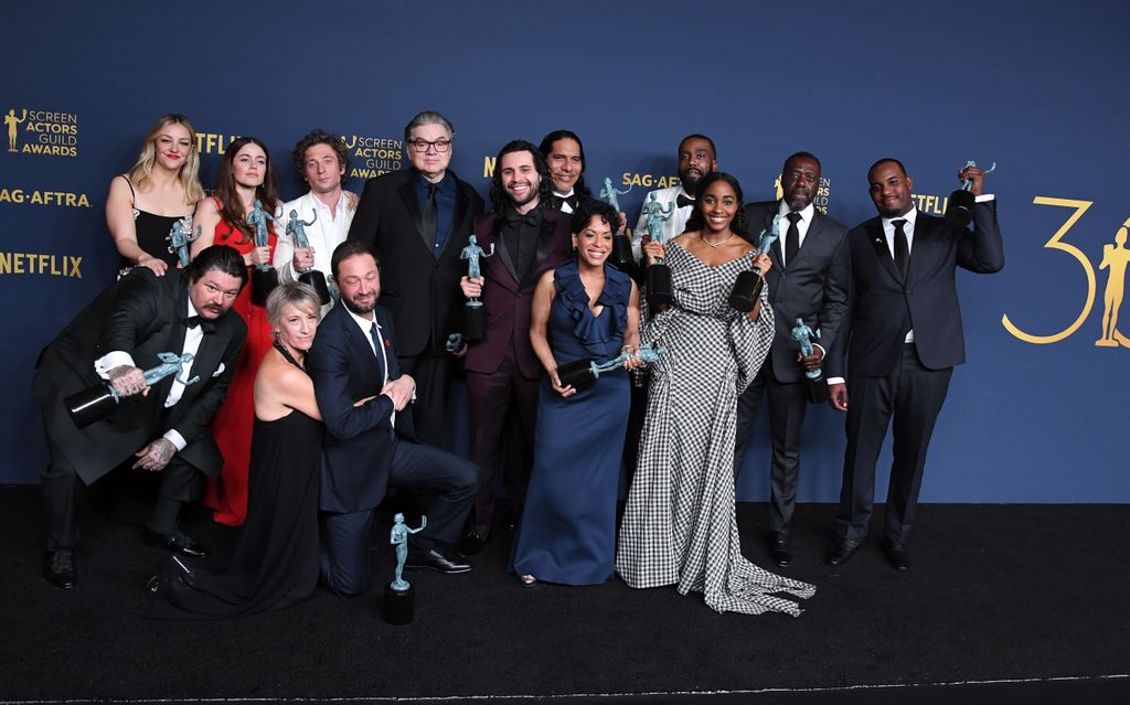 The cast of The Bear pose with their Outstanding Performance by an Ensemble in a Comedy Series award at the 2024 SAG Awards