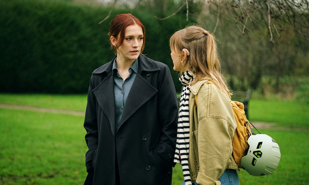 Two women walking in park