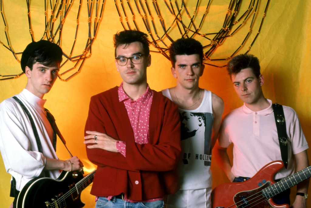 ROYAL OAK, MI - JUNE 8: (L-R) English guitarist Johnny Marr, English singer Morrissey, English drummer Mike Joyce and English bassist Andy Rourke of The Smiths pose for a portrait before their first show in Detroit during the 1985 Meat Is Murder Tour on June 8, 1985 at the Royal Oak Music Theatre in Royal Oak, Michigan.  (Photo by Ross Marino/Getty Images)