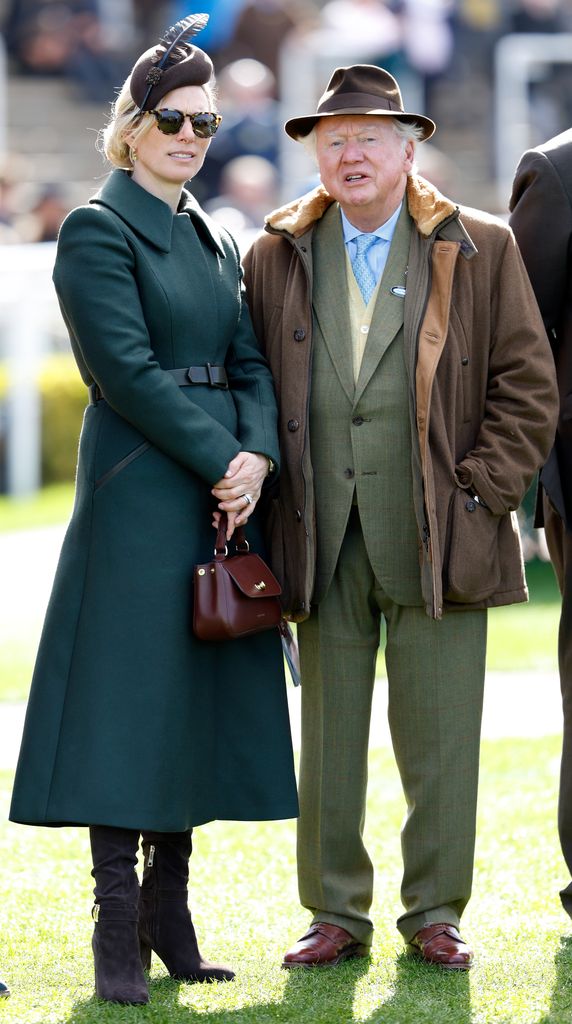 Zara Tindall in a cinched coat alongside Lord Anthony Bamford 