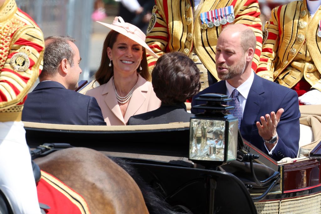 Princess Kate and Prince William riding alongside two French politicians