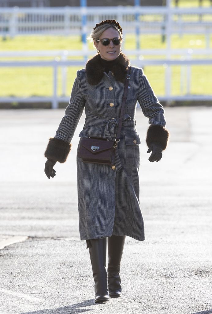 Zara Tindall wears an L.K.Bennett coat, leather boots, sunglasses and gloves