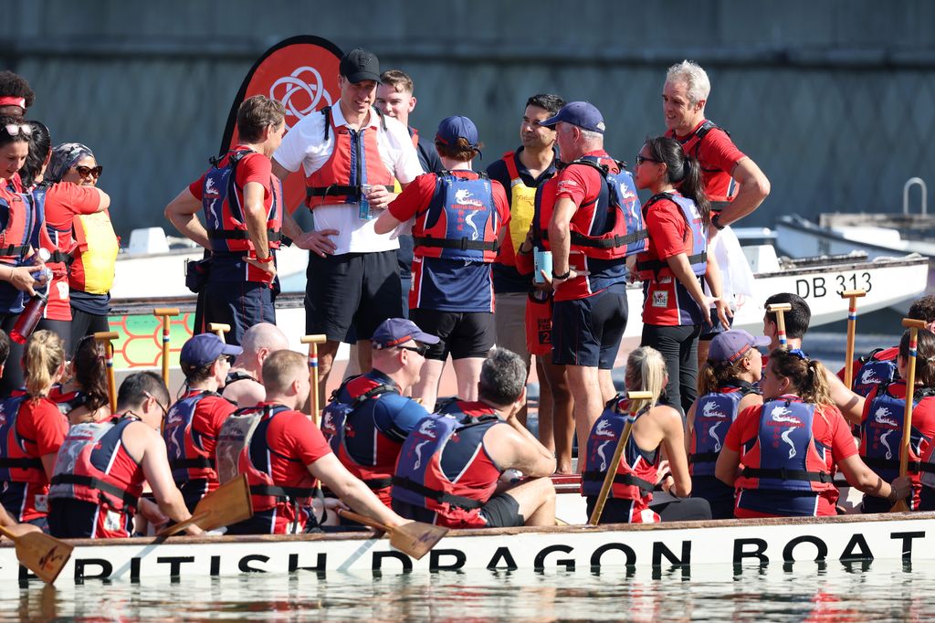 The Prince of Wales was praised as 'a natural' as his team won a dragon boat race on the Marina Reservoir