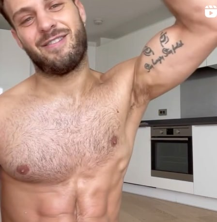 shirtless vito in his kitchen