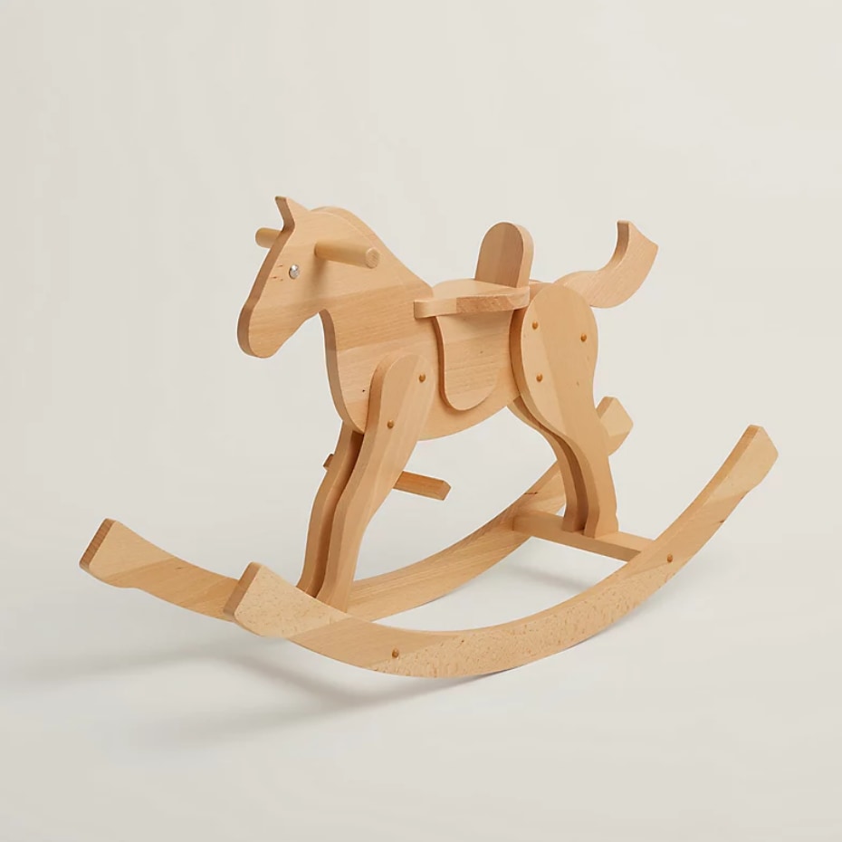 Photo of an Hermès wooden rocking horse for kids, from their website, listed for £2,830 as of November 2023