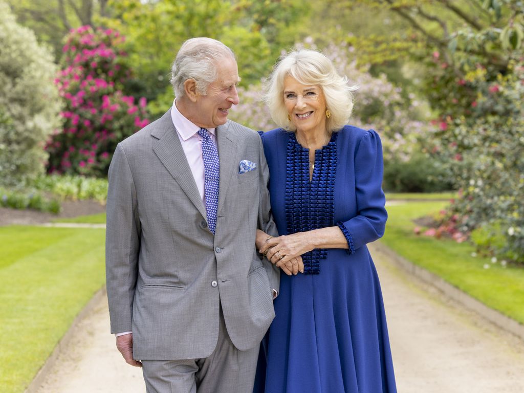 The King and Queen pictured in the gardens at Buckingham Palace