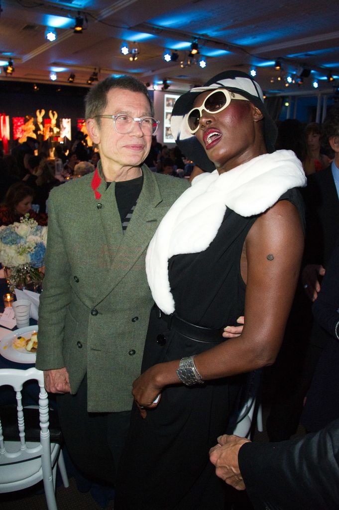 Grace and Jean Paul Goude hug at event