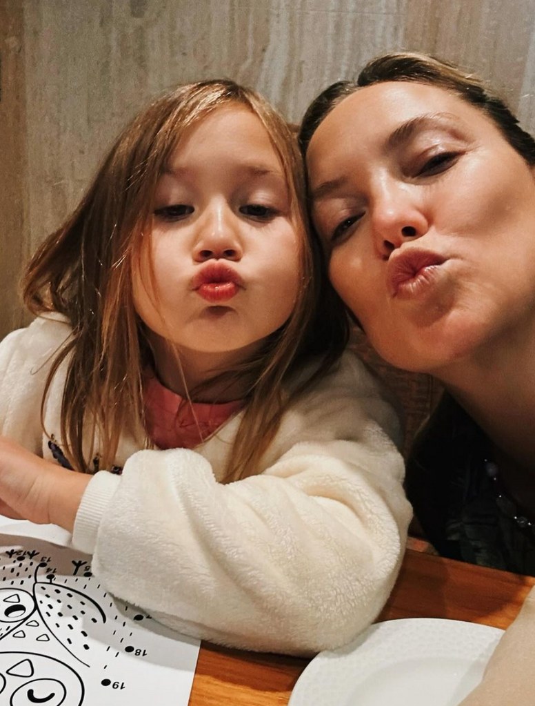 Photo shared by Kate Hudson on Instagram February 2024 in which she is making a kissy face at the camera alongside her daughter Rani Rose, who she shares with fiancé Danny Fujikawa