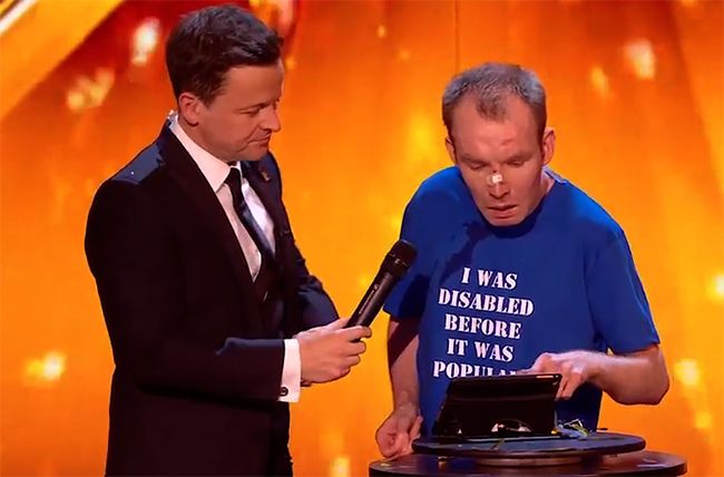 declan donnelly holds out microphone