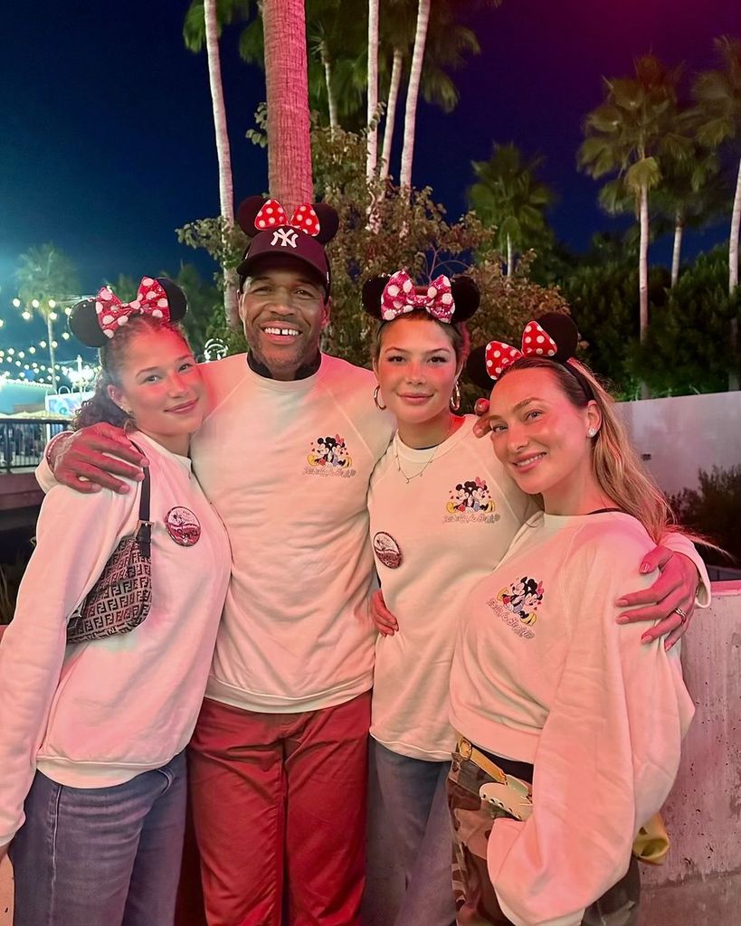 Michael Strahan celebrates his daughters Sophia and Isabella's birthdays at Disney with his girlfriend Kayla Quick