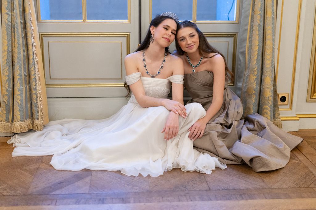 Gabrielle Janssens de Balkany and Almudena Dailly de Orleans satin on floor in ball gowns
