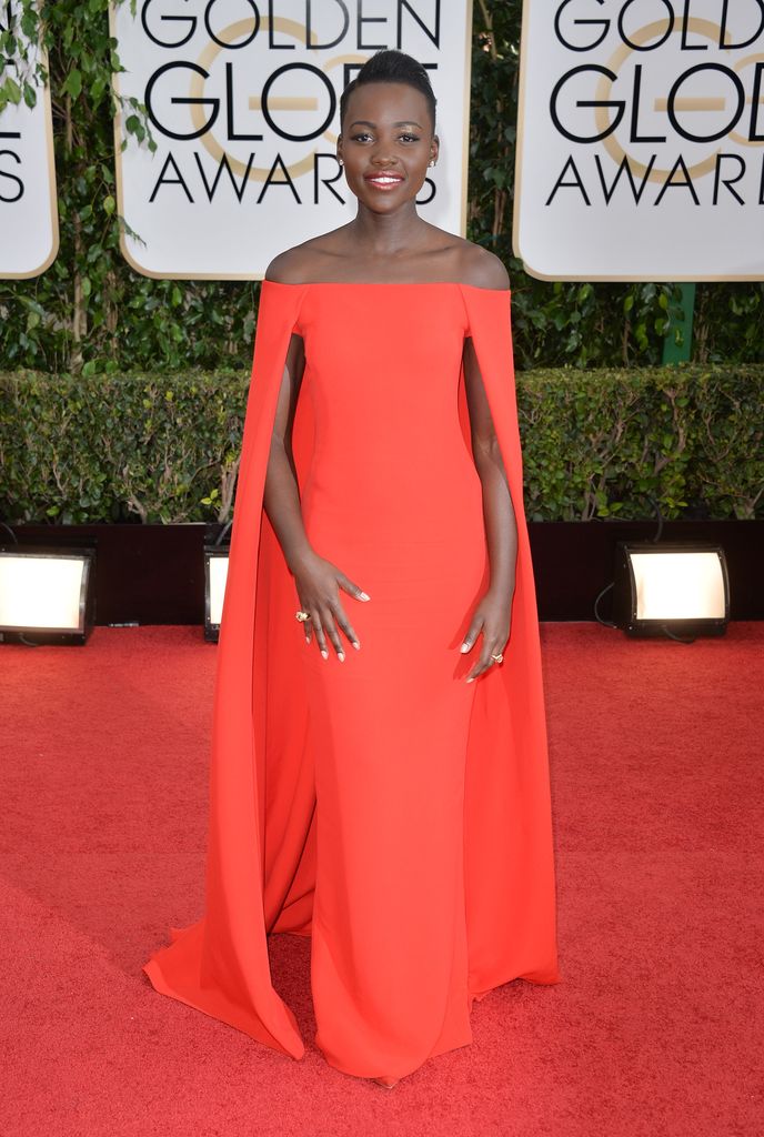 Lupita Nyong'o on red carpet in red dress