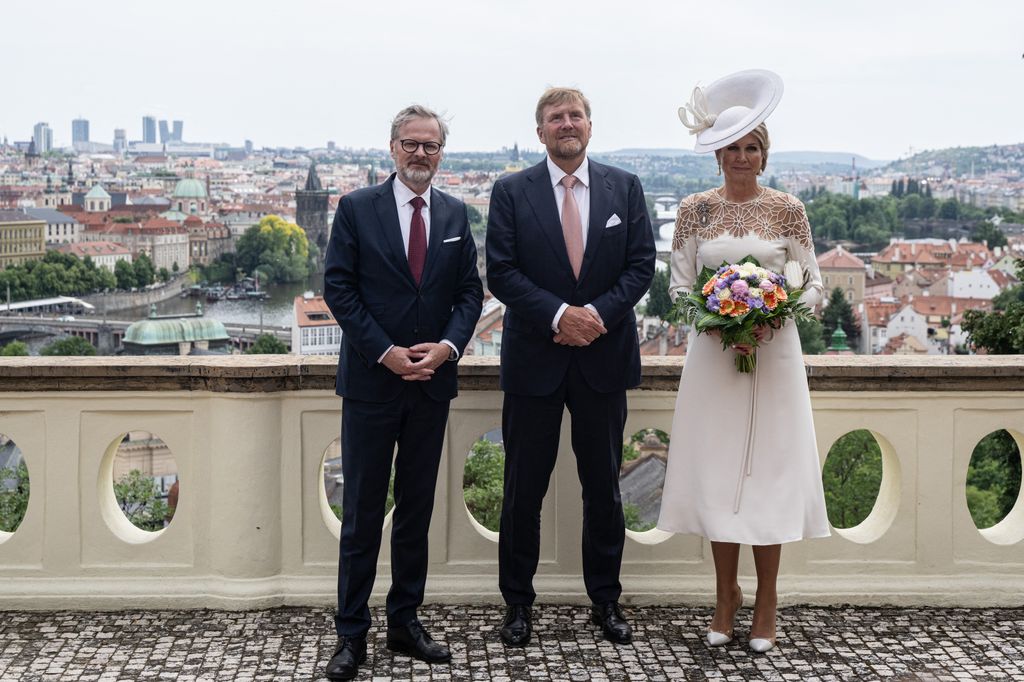Czech Republic's Prime Minister Petr Fiala (L), King Willem-Alexander of the Netherlands (C) and his wife Queen Maxima of Netherlands (R) pose in the Kramer Villa 