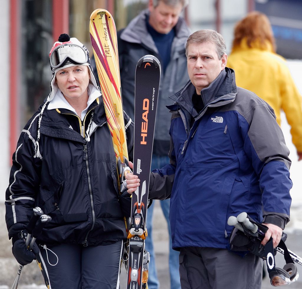 Sarah and Andrew Mountbatten-Windsor both wear ski gear and hold skis as they pose together.