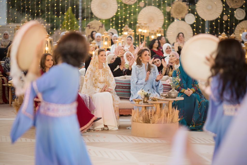 Queen Rania alongside Rajwa at her traditional henna party