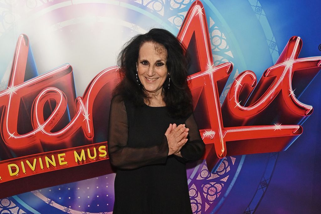 Lesley Joseph in front of sister act poster