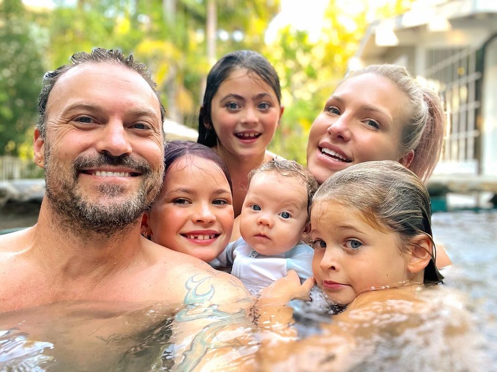 Sharna with Brian and his three young sons in jacuzzi