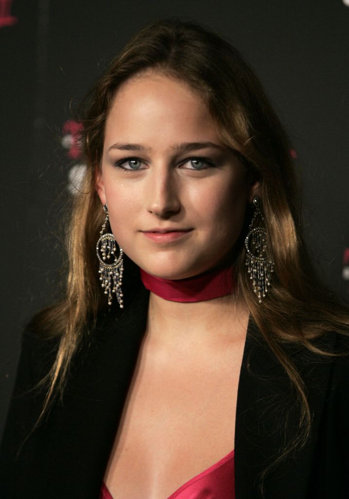 Leelee Sobieski smiling wearing big earrings